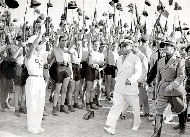 Benito Mussolini and Fascist Blackshirt youth in 1935.