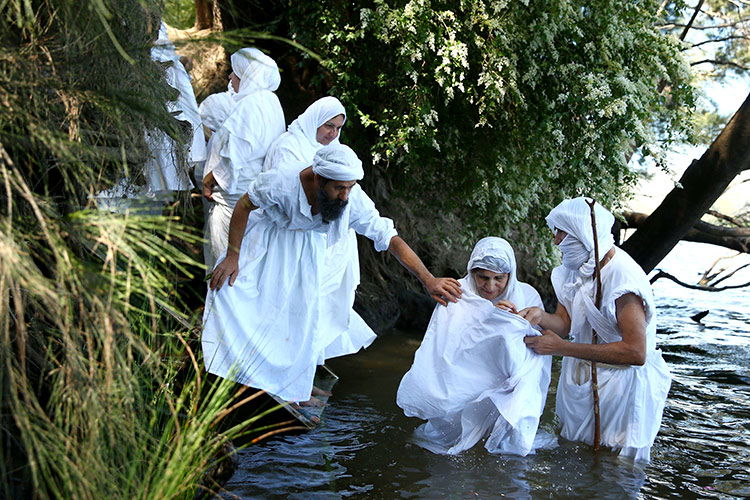 Mandeans perform a baptism ceremony in the River Nepean, Sydney, Australia