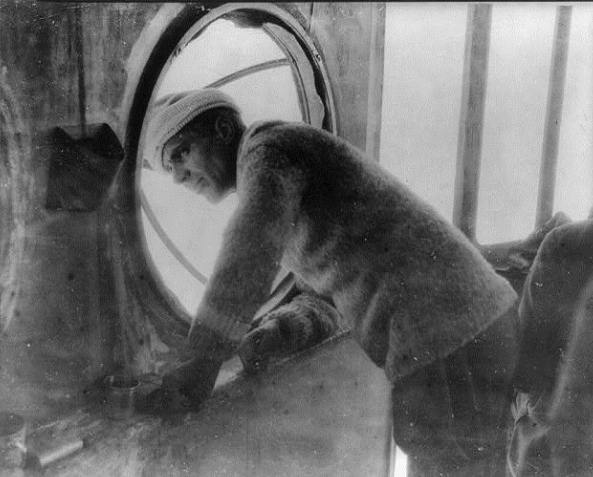 Col. Umberto Nobile, designer of the "Norge," watching her departure from the base at Spitzbergen