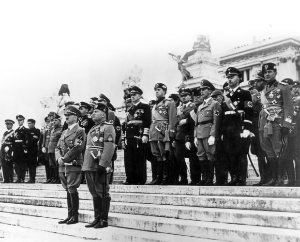 Mussolini and Hitler with Nazi and Fascist officials on the steps of the Vittoriano in May 1938. The Fascist leader used the monument to reinforce his status as national leader