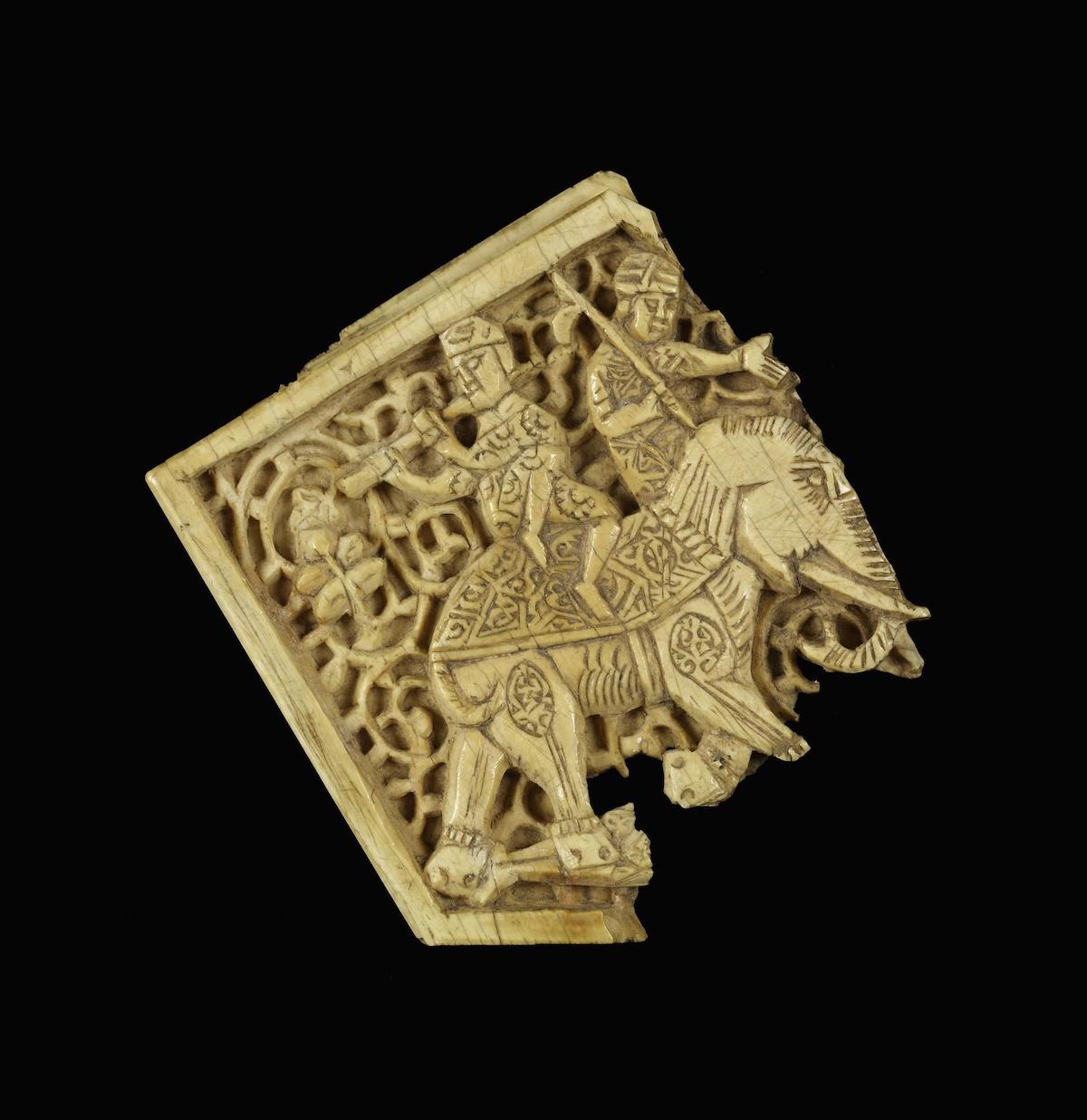 An Egyptian ivory plaque showing two figures riding an elephant, c. 11th-12th century. Walters Art Museum (CC0).