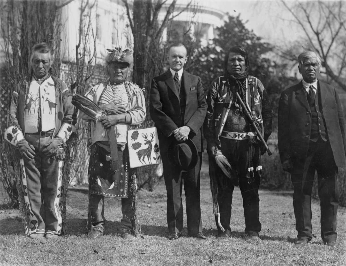 President Calvin Coolidge with Native American delegates, possibly of the Yakama Nation, at the White House, 1925. Library of Congress. Public Domain.