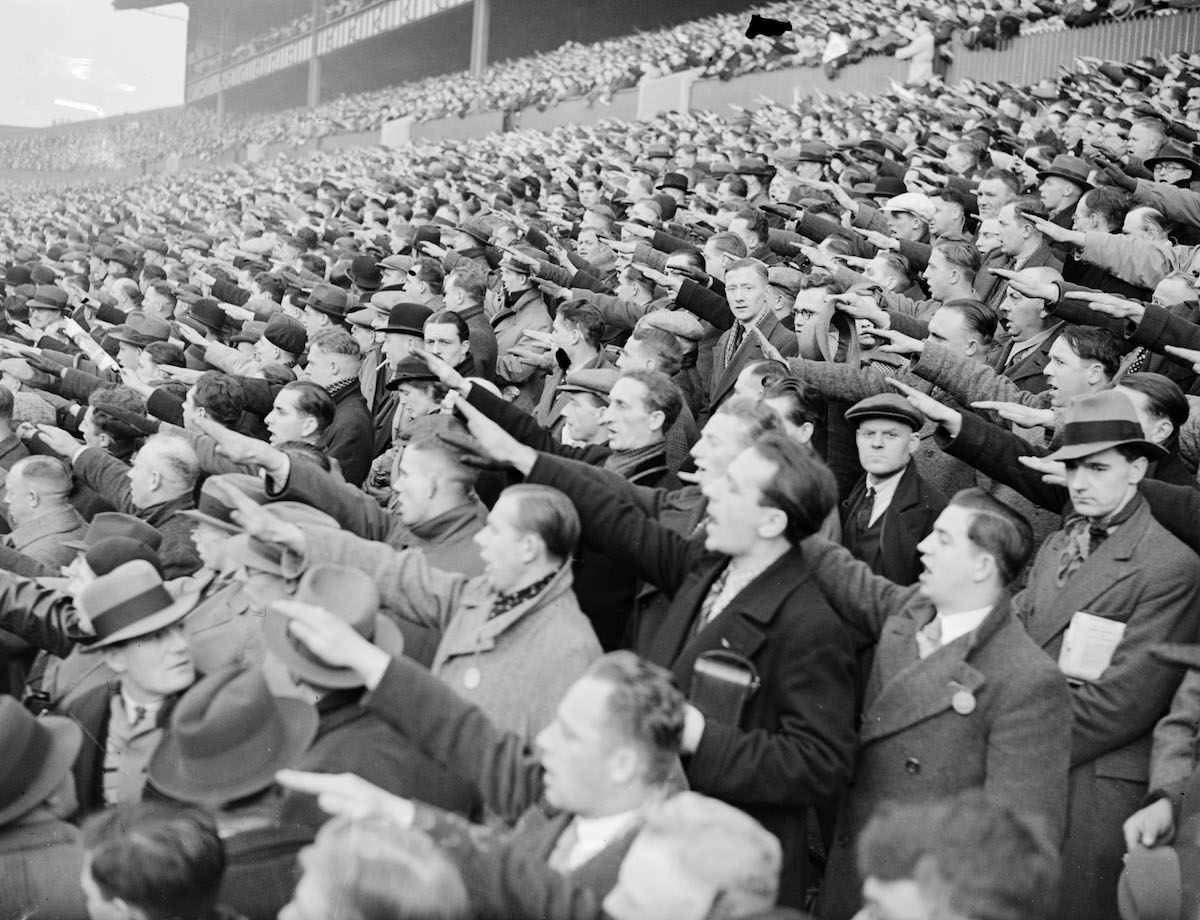 German football supporters giving the Nazi salute, White Hart Lane, London, 1935. Mirrorpix/Alamy Stock Photo.