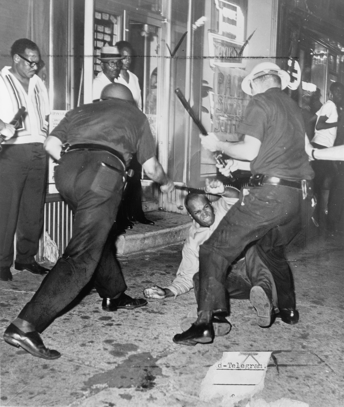 Police beat protestors during the Harlem Riots, New York. World Telegram & Sun photo by Dick De Marsico, 1964. Library of Congress. Public Domain.