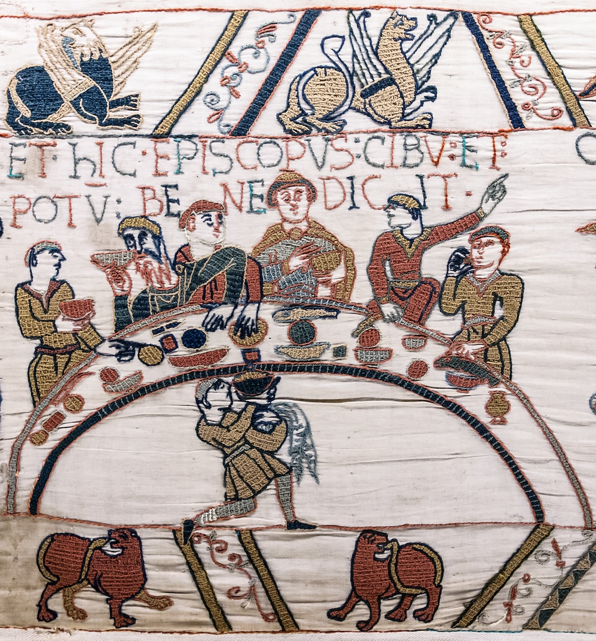 Bishop Odo blesses the food and wine, detail from the Bayeux Tapestry,  late 11th century. Bridgeman Images.