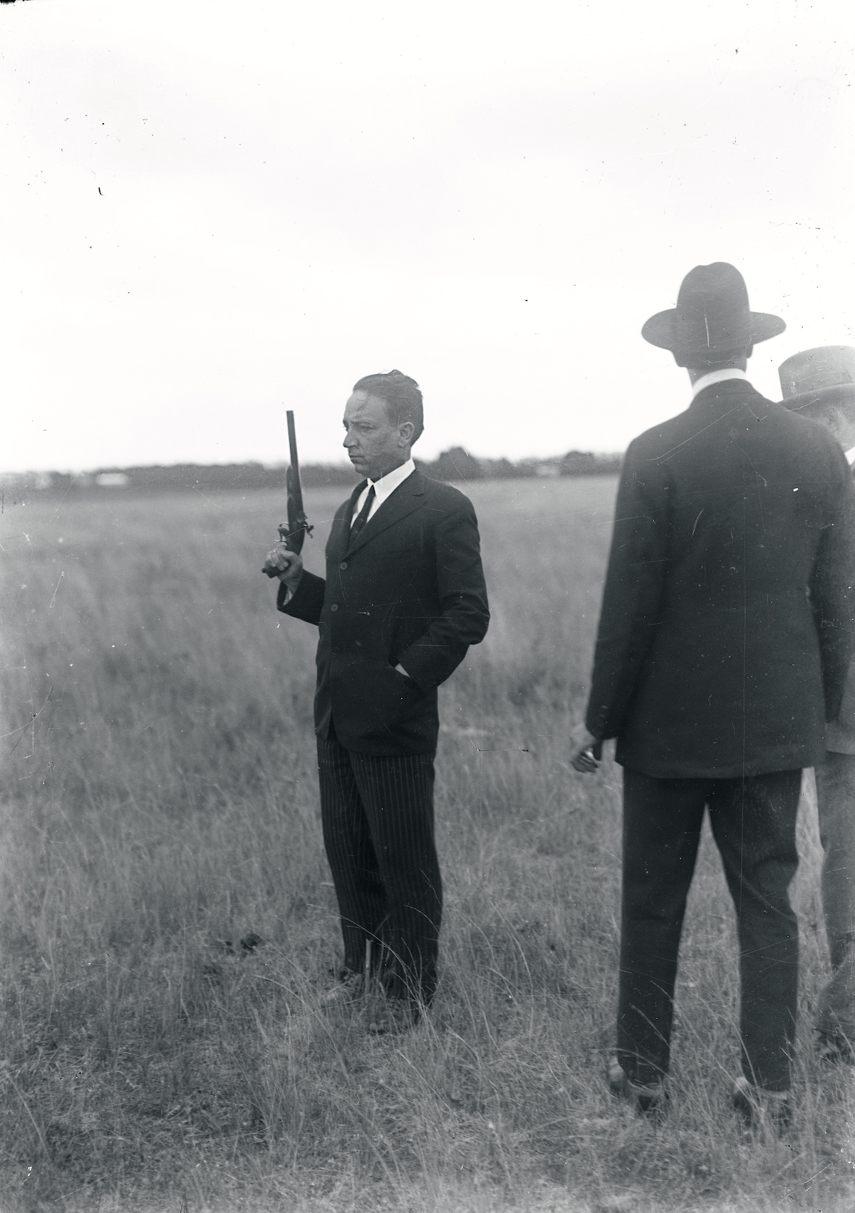 Former-president Baltasar Brum prepares to face minister of war Alberto Riverós, 1924. On the signal,  he chose to shoot at the ground while Riverós fired into the air. Archivo Fotografico de El Pais, Montevideo.