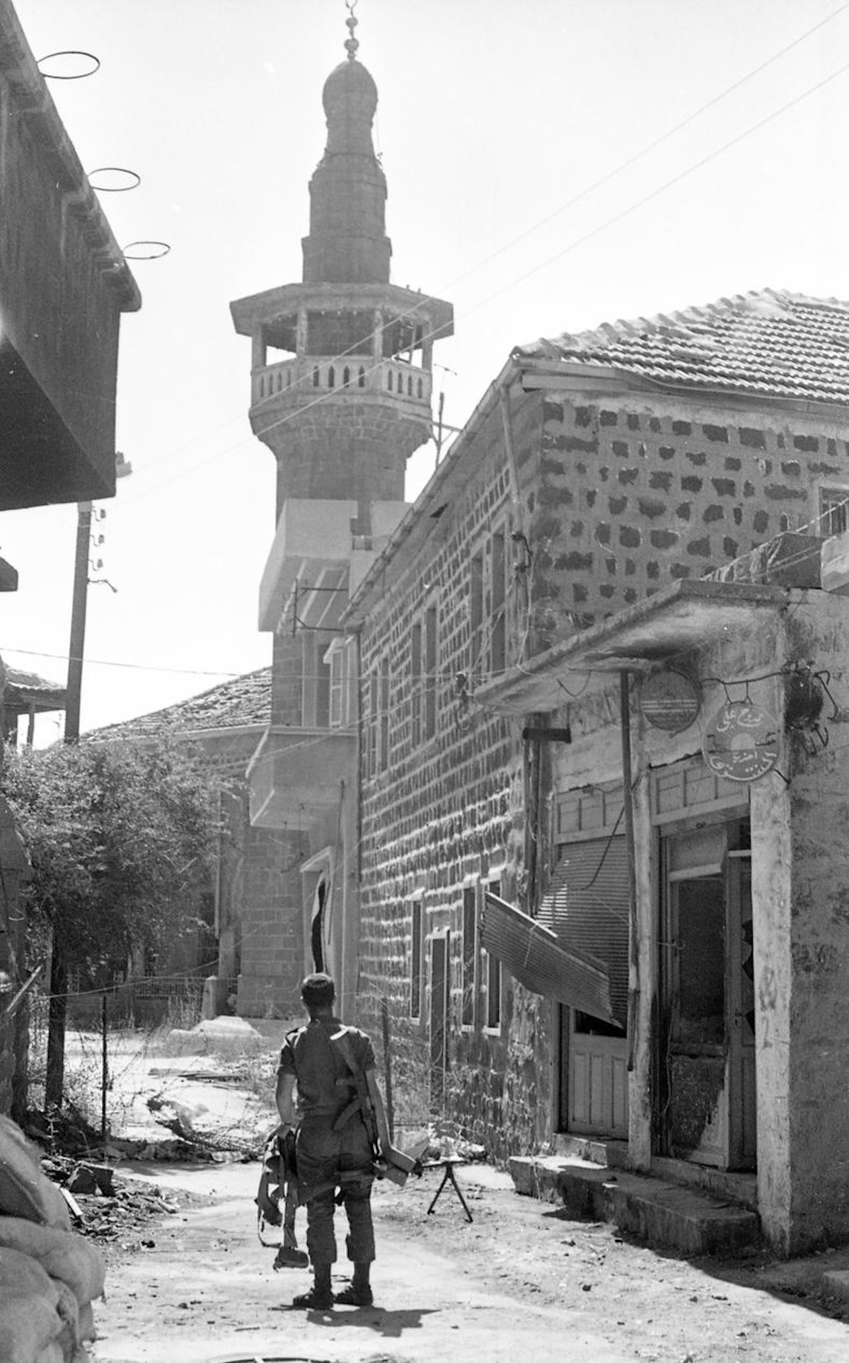 An Israeli soldier patrols the Syrian town of Majdal Shams in the Golan Heights, 1969. National Library of Israel (CC BY).