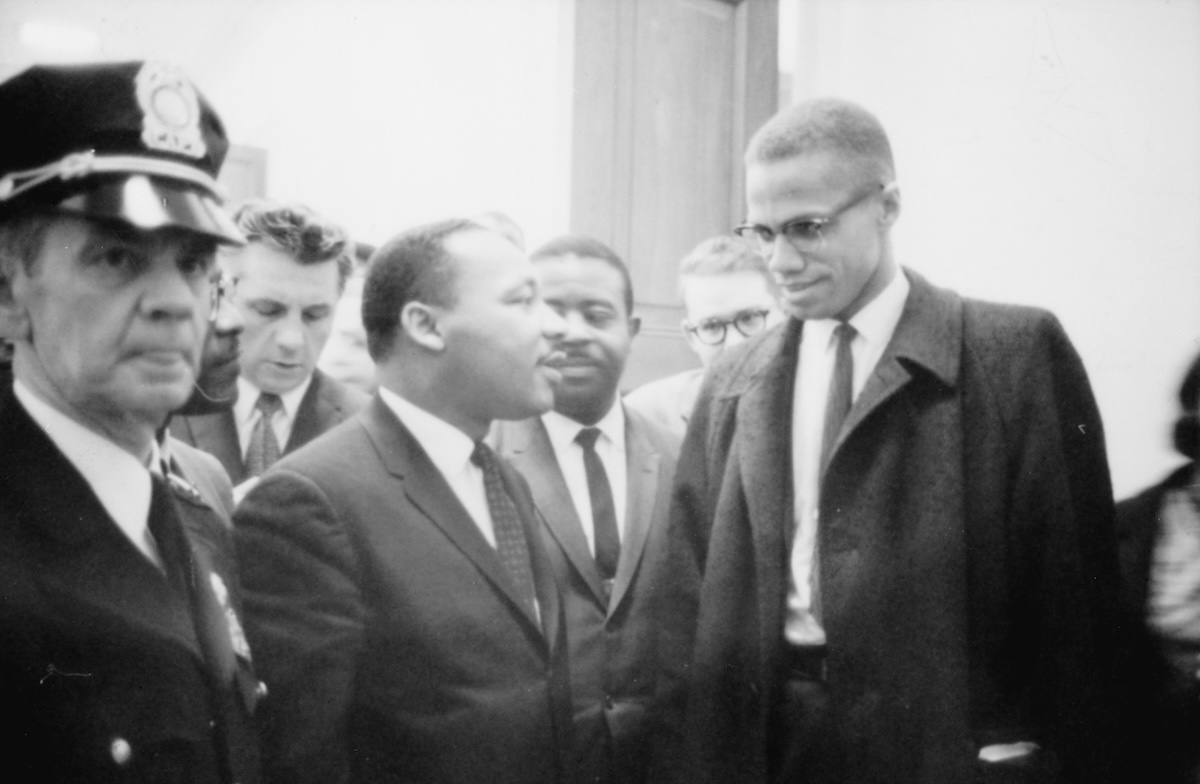 Martin Luther King and Malcolm X after King's press conference at the U.S. Capitol about the Senate debate on the Civil Rights Act of 1964. Library of Congress. Public Domain.