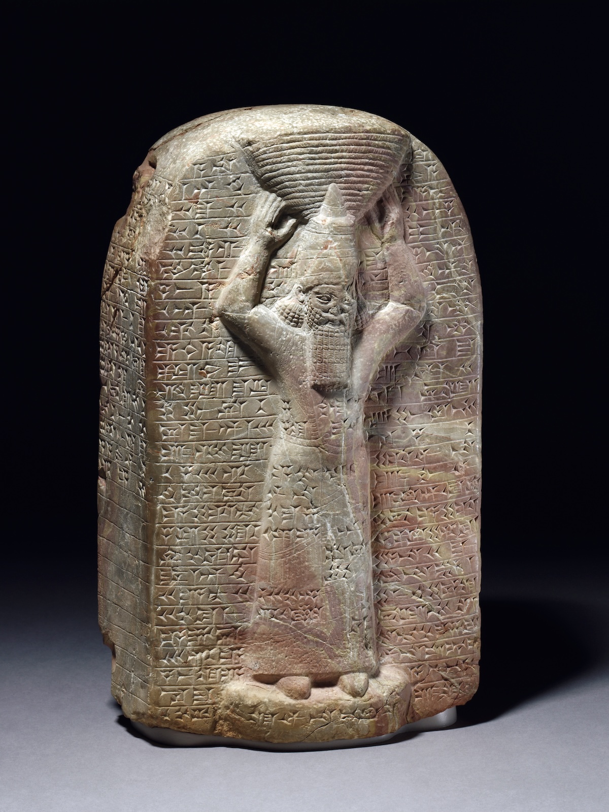 Stone stela of Ashurbanipal inscribed with cuneiform commemorating his building work on the Temple of Marduk in Babylon. Trustees of the British Museum.