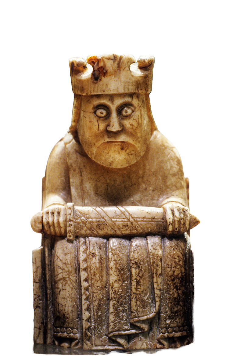 A king from the Lewis chessmen, made of walrus ivory probably obtained from Greenland, 12th century. Holmes Garden Photos/Alamy Stock Photos.