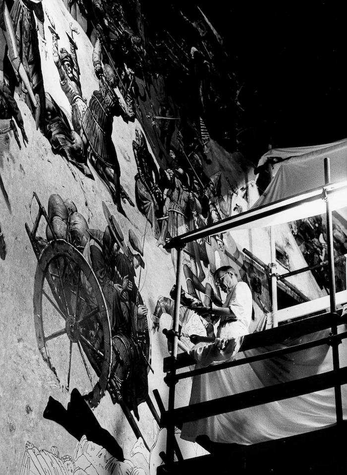 Werner Tübke working on his panoramic painting Early Bourgeois Revolution in Germany, Bad Frankenhausen, 1986. AND-Bildarchiv/ullstein bild/Getty Images.