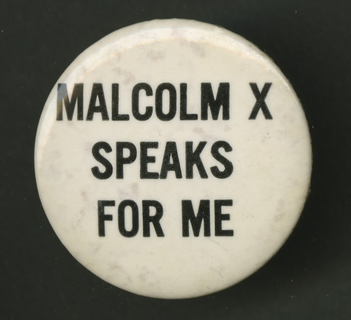 A 1960s pinback button showing support for Malcolm X. National Museum of African American History and Culture. Public Domain.