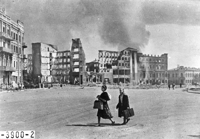 Civilians walk through the ruins of Stalingrad in the immediate aftermath of the Second World War, 1945. Nationaal Archief. Public Domain.