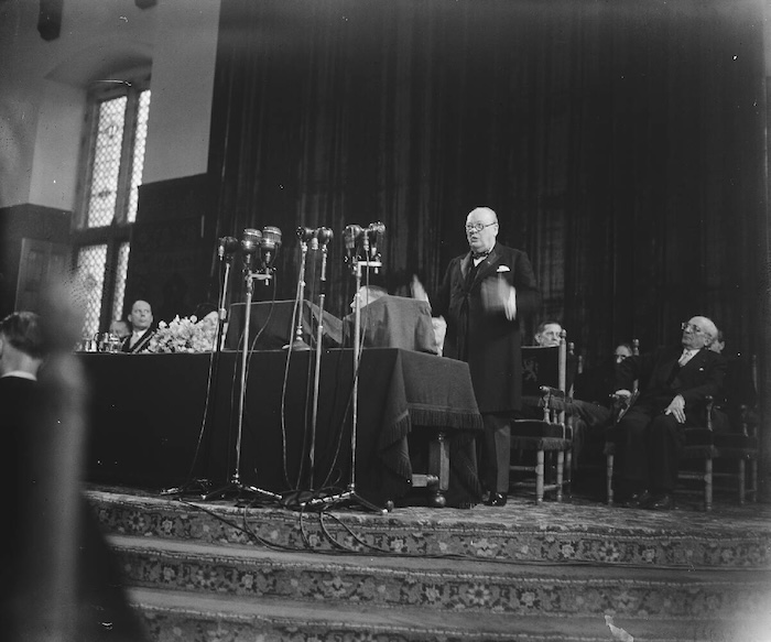 European Congress Knights Hall The Hague. Wisnton Churchill gives a speech to the European Congress in The Hague, Netherlands, by Anton Snikkers, 5 September 1948. Nationaal Archief. Public Domain.