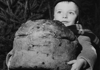 A child carrying a panettone in Milan, 20 December 1958.