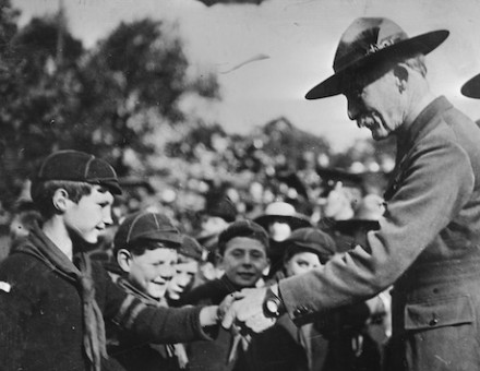 Sir Robert Baden-Powell congratulations a Wolf Cub on his father being awarded the Victoria Cross, November 1918. Library of Congress. Public Domain.